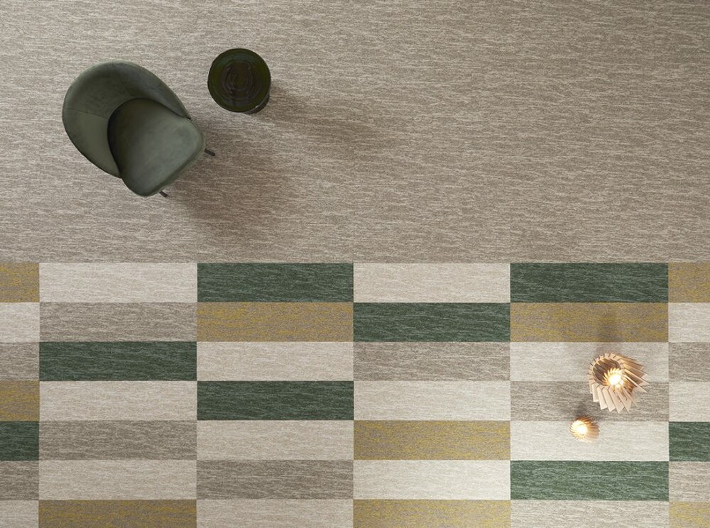 Top shot of rectangular carpet tiles in green, cream and neutral colours